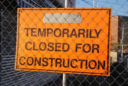 Image of sign reading "Temporarily Closed For Construction"