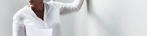 Image of a teacher pointing at a white board